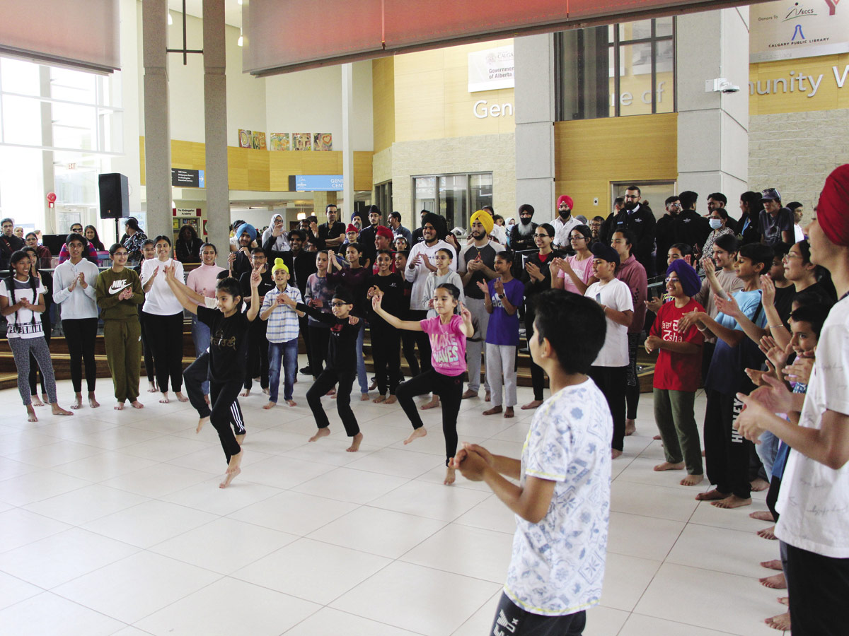 Members of Young Bhangra lead Bhangra dance in the Commons