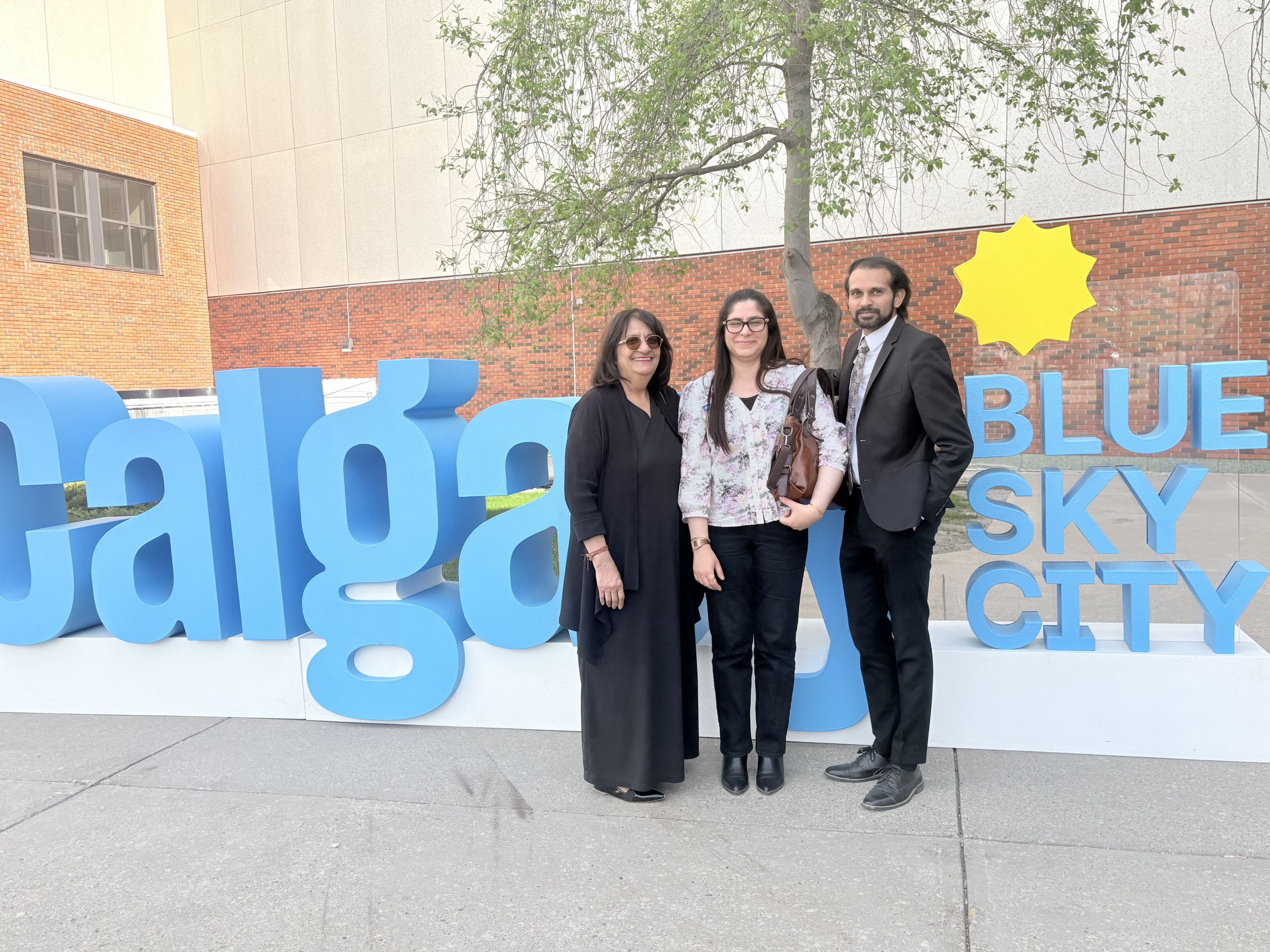 Loveleen Kapoor with Genesis Centre representatives in Calgary